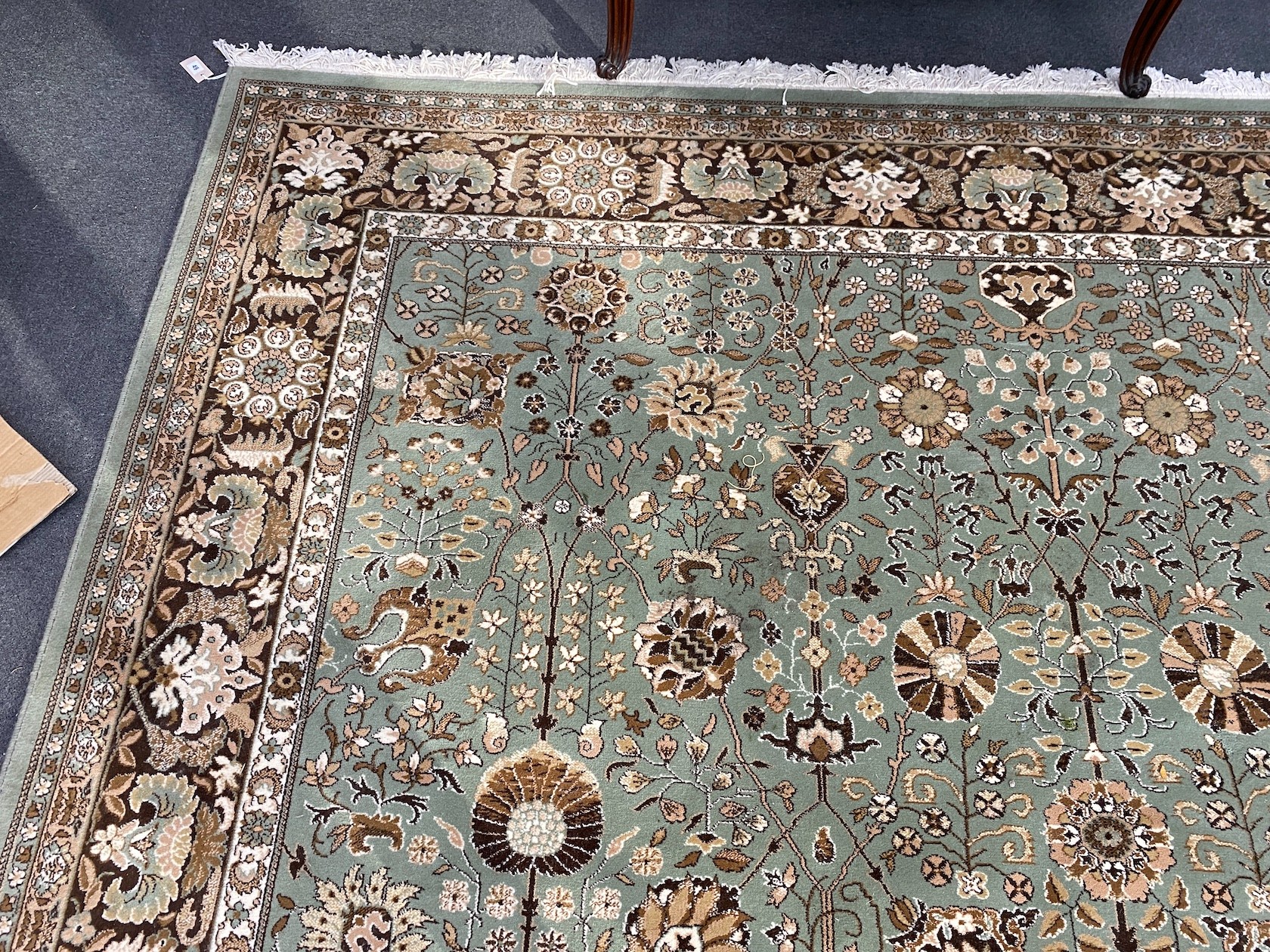 A Tabriz style green ground carpet, 400 x 300cm